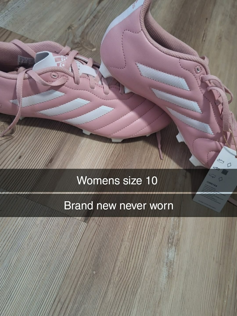adidas Women’s Pink Soccer Cleats with White Stripes